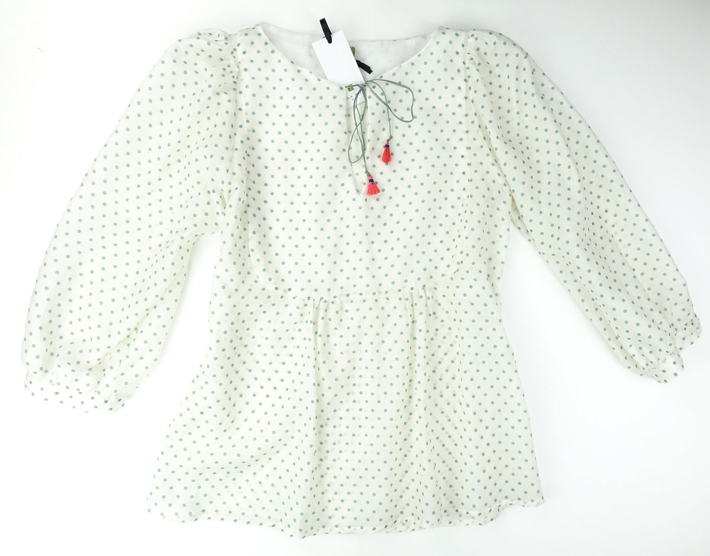 Cream shirt with light blue polka dots and tassels