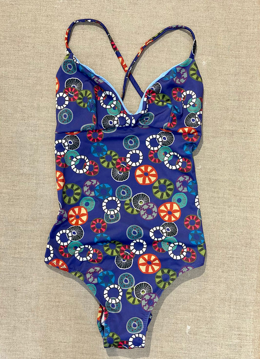 Margot one-piece swimsuit with donut print on a blue background
